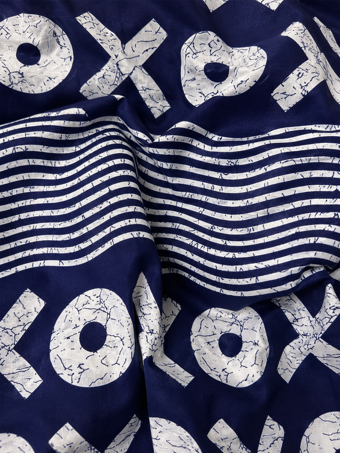 Navy blue fabric with white text and patterns